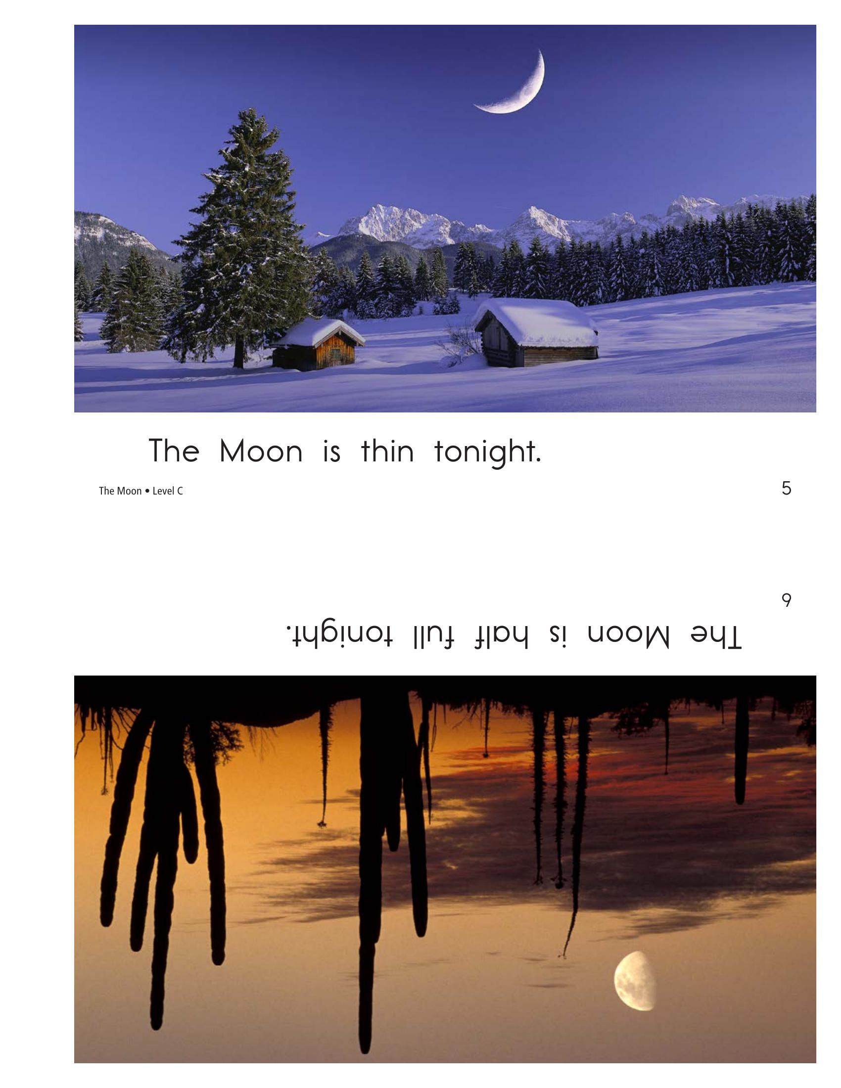 Thin crescent moon over snowy mountains